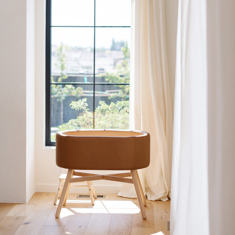 M26834GCLB,babyletto x GATHRE Capsule Bassinet in Camel