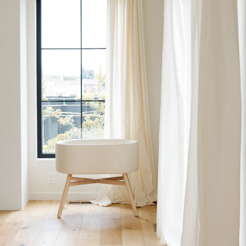 M26834GYLB,babyletto x GATHRE Capsule Bassinet in Ivory